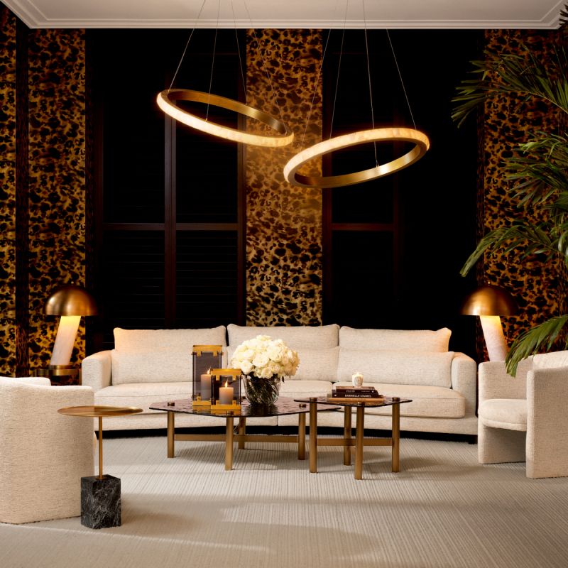 Slightly curved off-white sofa with sleek black feet.