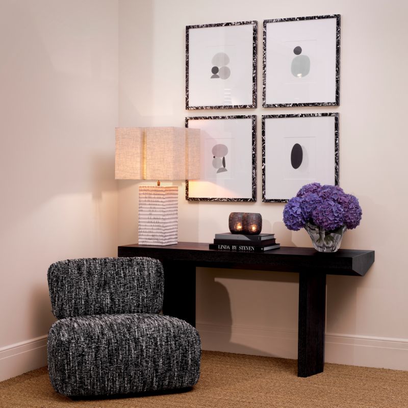 Black artistic wooden frame containing minimalist prints