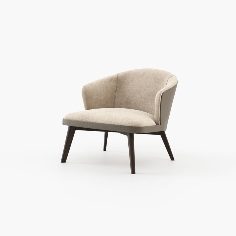 A chic, Mid-Century inspired armchair with two materials and contrasting black ash legs  