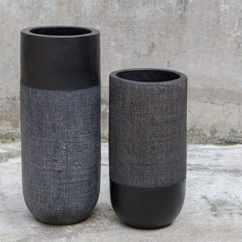 Elevate your decor with these black terracotta vases, blending earthy craftsmanship and modern design with woven accents for rustic elegance.