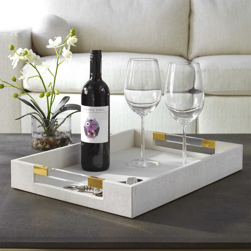 A sophisticated faux shagreen tray with beautiful brass details
