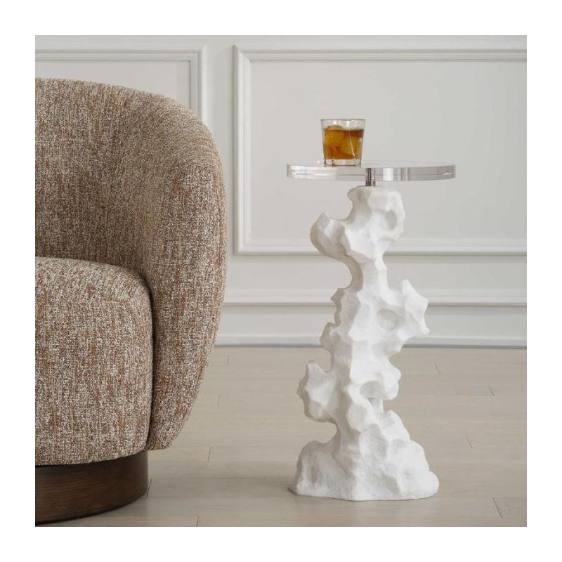 Artistic side table composed of white stone with circular glass top