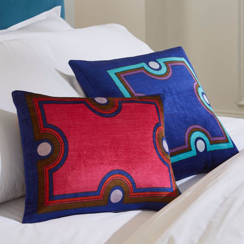 Sumptuous red, blue and brown cushions with a modern pattern 