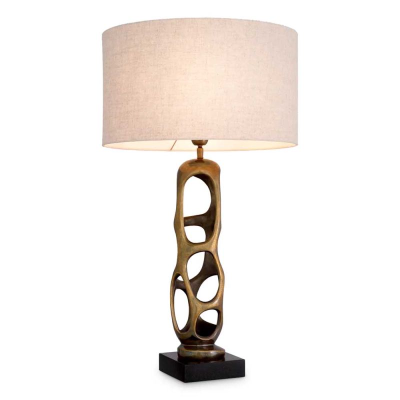 Brass structure table lamp with hole details and linen shade