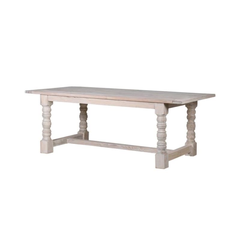 A large classic dining table made from mahogany with a white wash finish