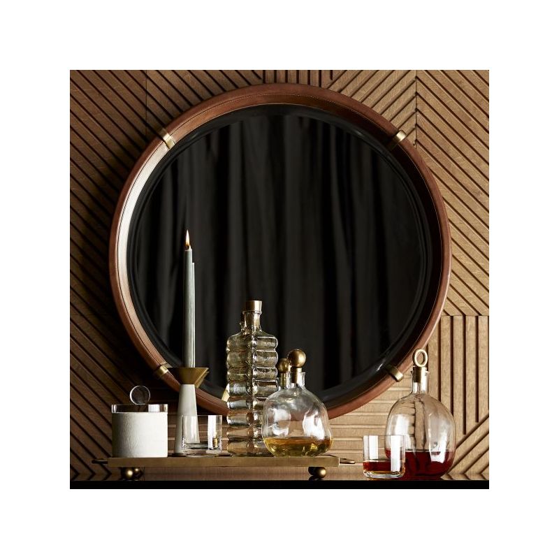 Leather round mirror with brass accents and round mirror glass