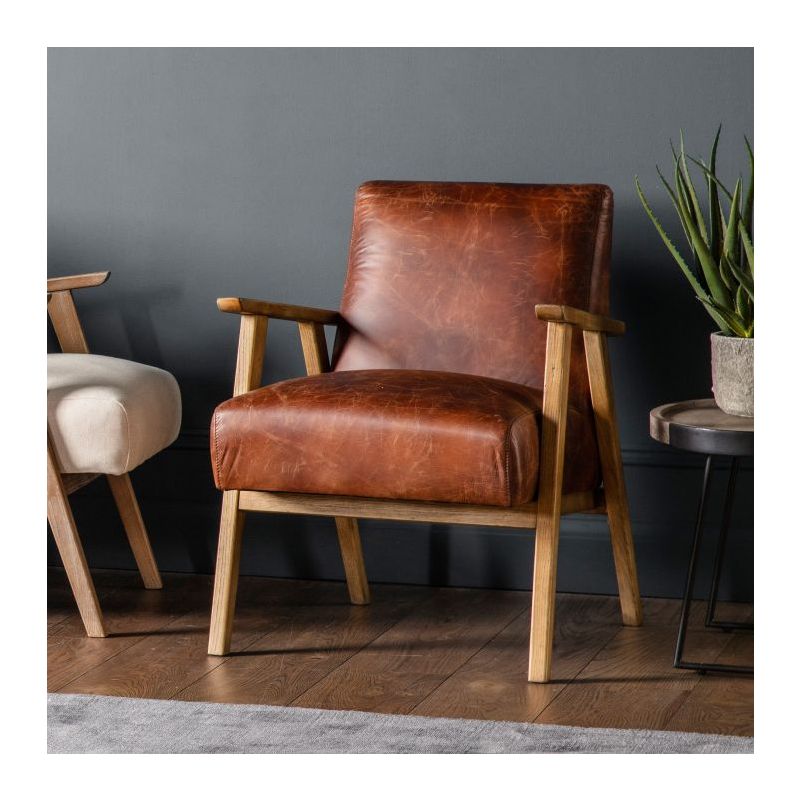 Mid-century style armchair with modern silhouette and brown leather upholstery