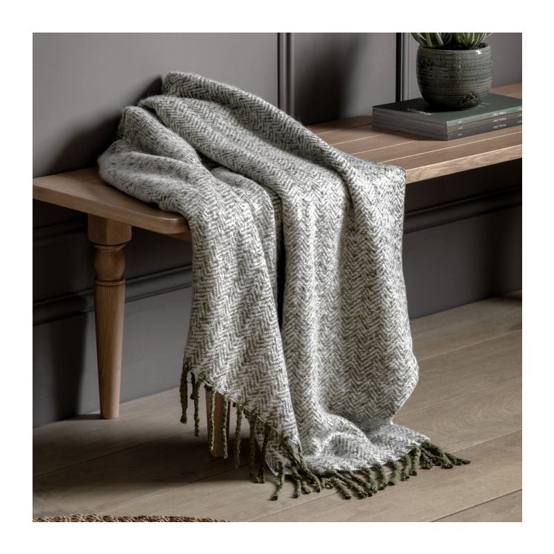 Green herringbone throw with green tassels 