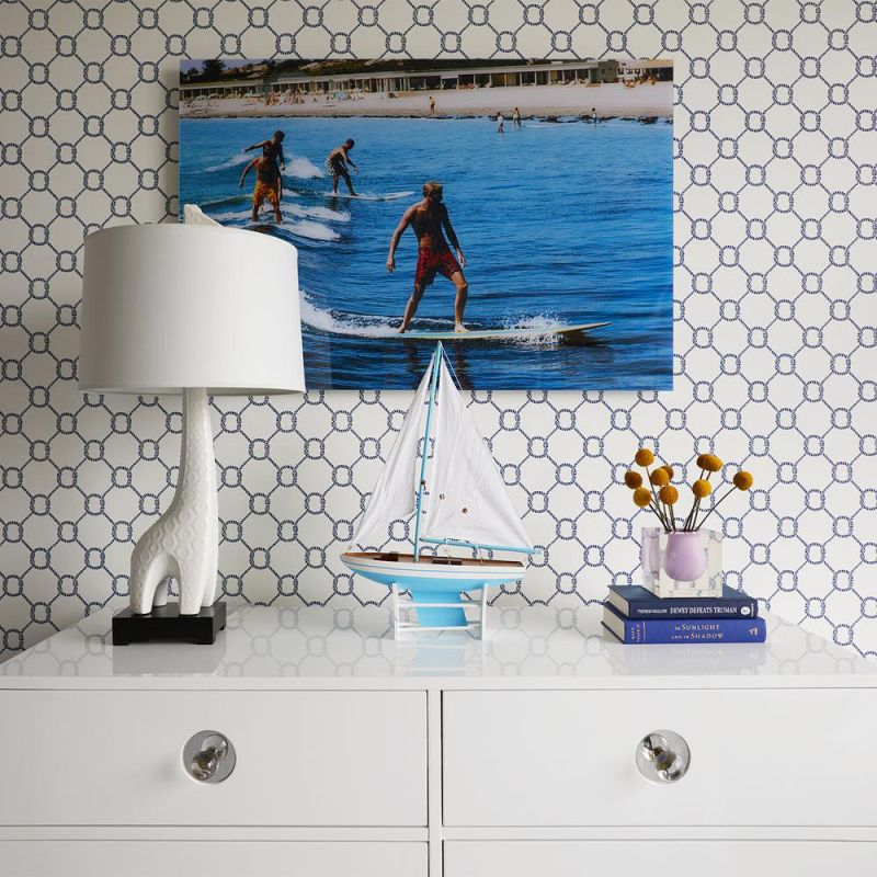An elegantly playful giraffe-shaped high-fired stoneware table lamp
