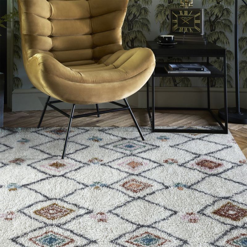 Multi-coloured patterned table tufted wool rug 