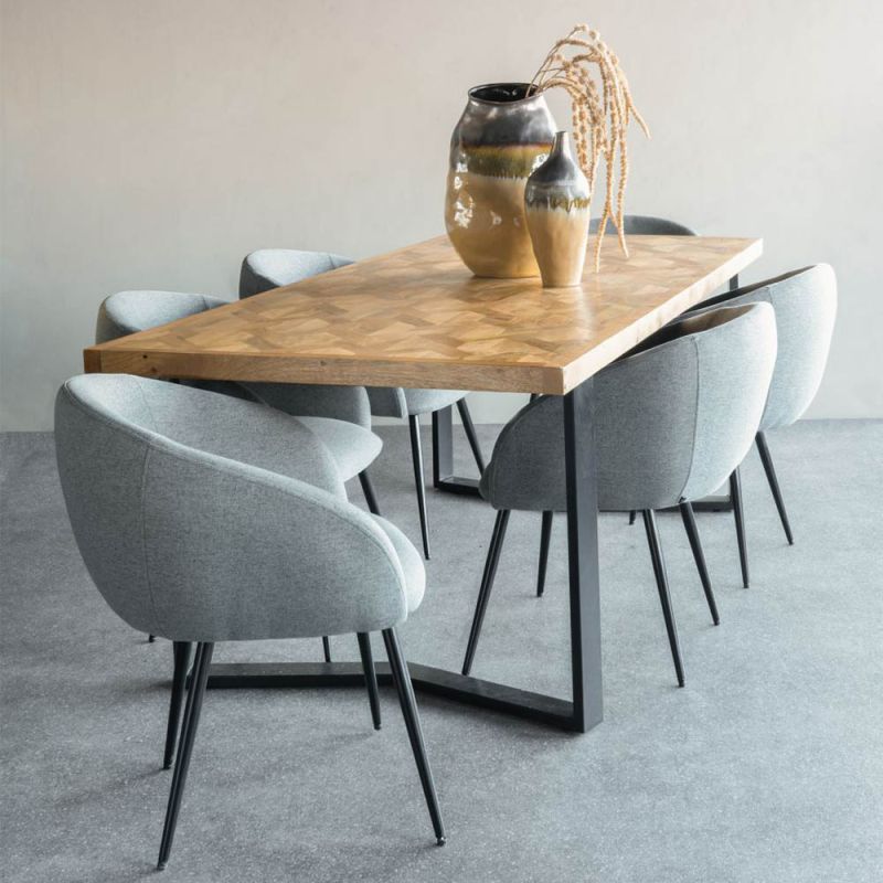 curvaceous and dark grey upholstered dining chair 