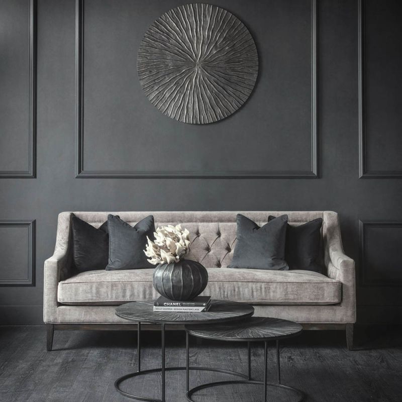 Luxury grey sofa with deep studding details and curved arms