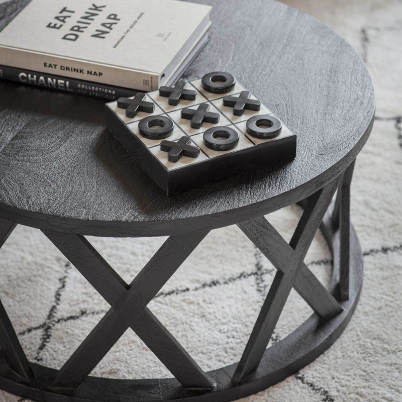 round dark wooden coffee table with luxurious detailed supportive beams