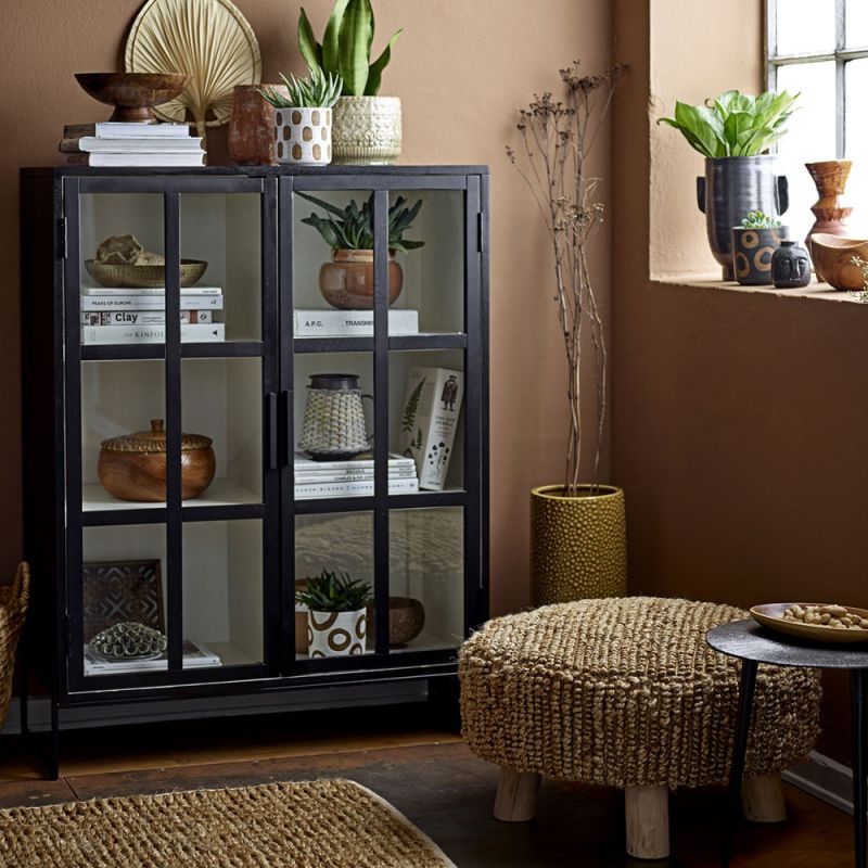 A chic, industrial-style display cabinet with a black oak and metal finish