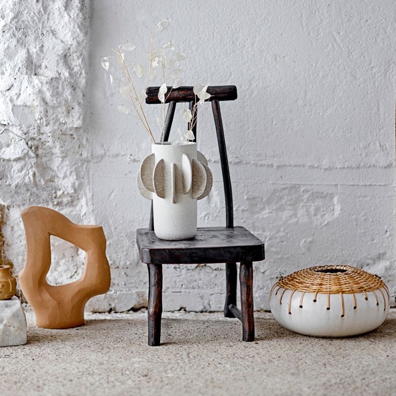 A charming pedestal by Bloomingville crafted from recycled wood