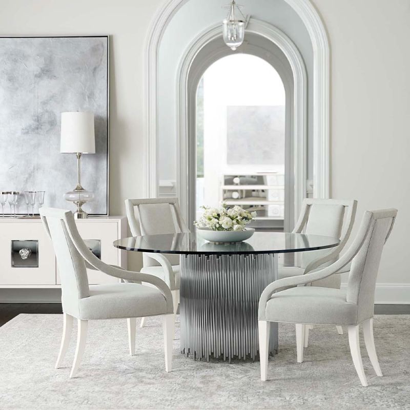 circular dining table with glass top and pipe details