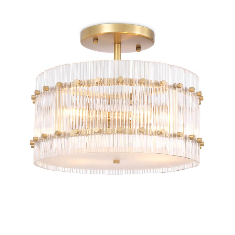 glamorous ceiling lamp in antique brass and encircled by ribbed clear glass