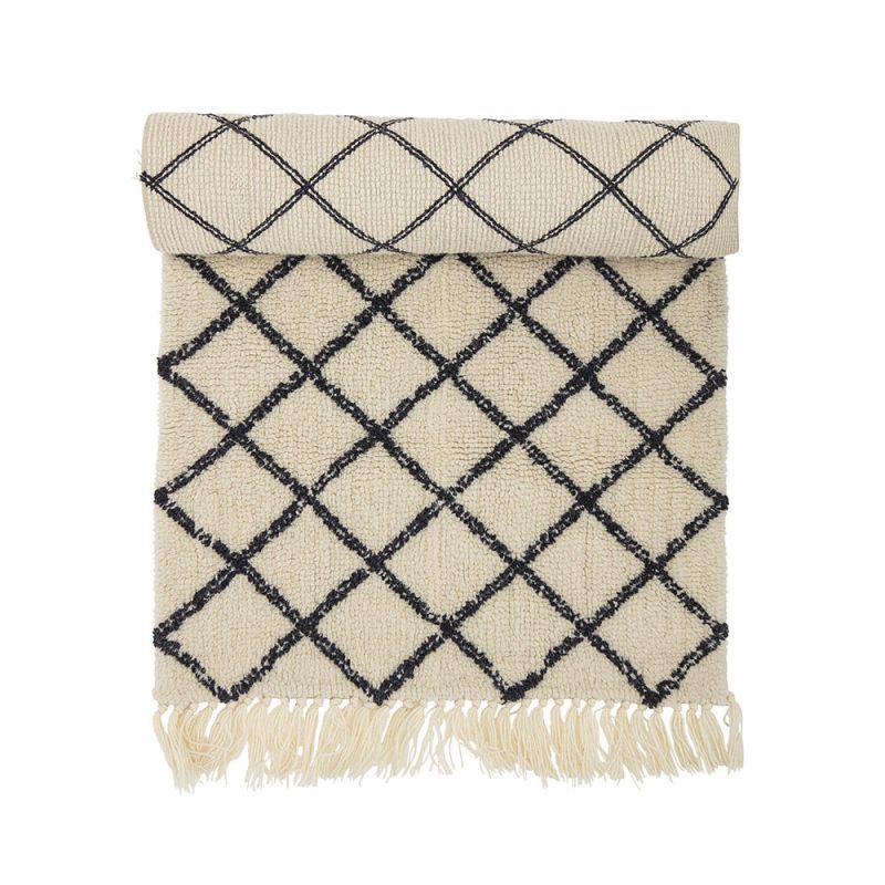 Sumptuous black and cream rug with fringe detail