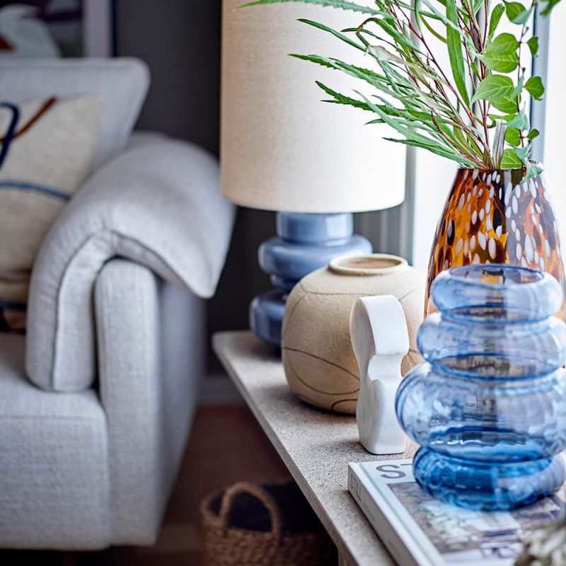 Blue coloured glass vase in curved design