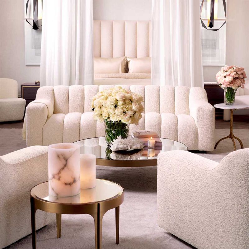 Round side table with brass frame and bevelled glass surface