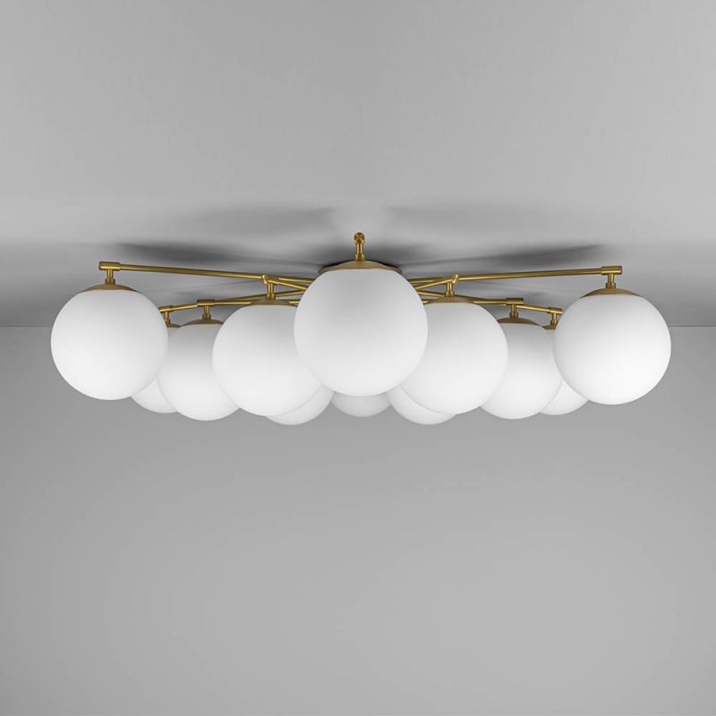 Elegant ceiling light with round white shades and brass fixture