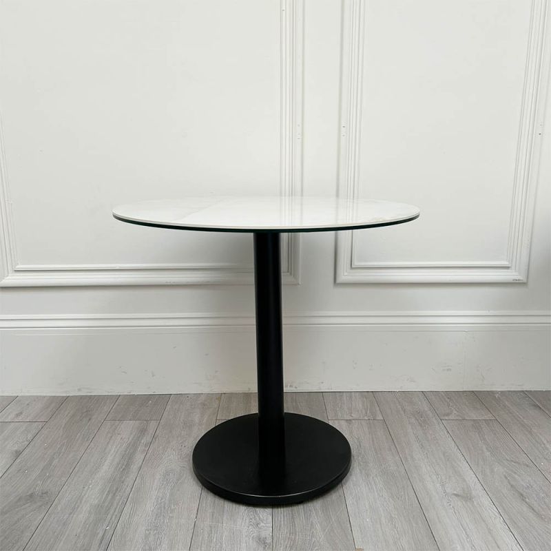 Elegant round bar table with chipped ceramic top