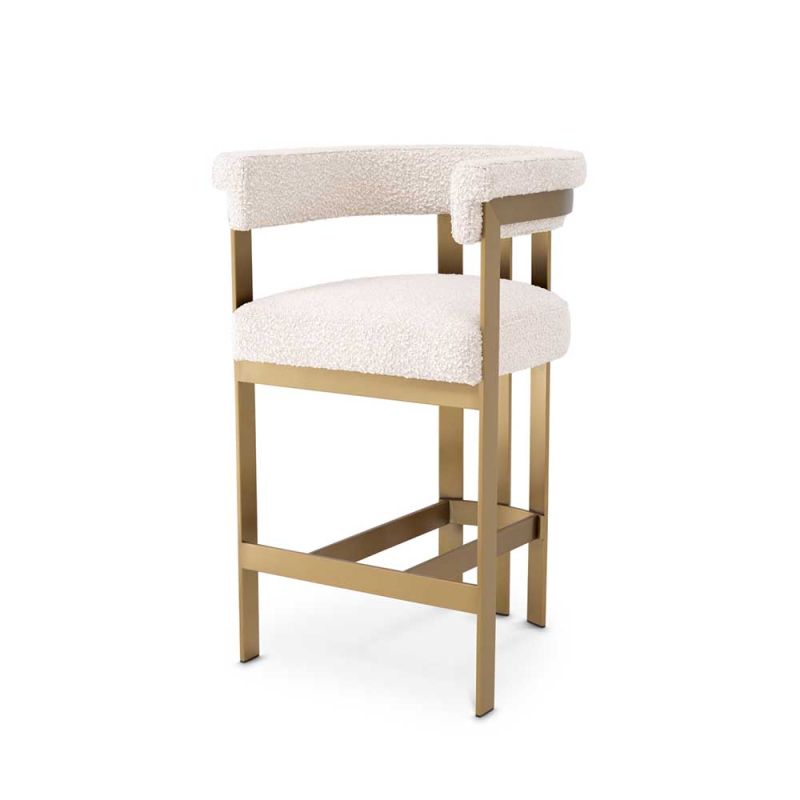 Glamorous brass frame counter stool and cream boucle upholstery