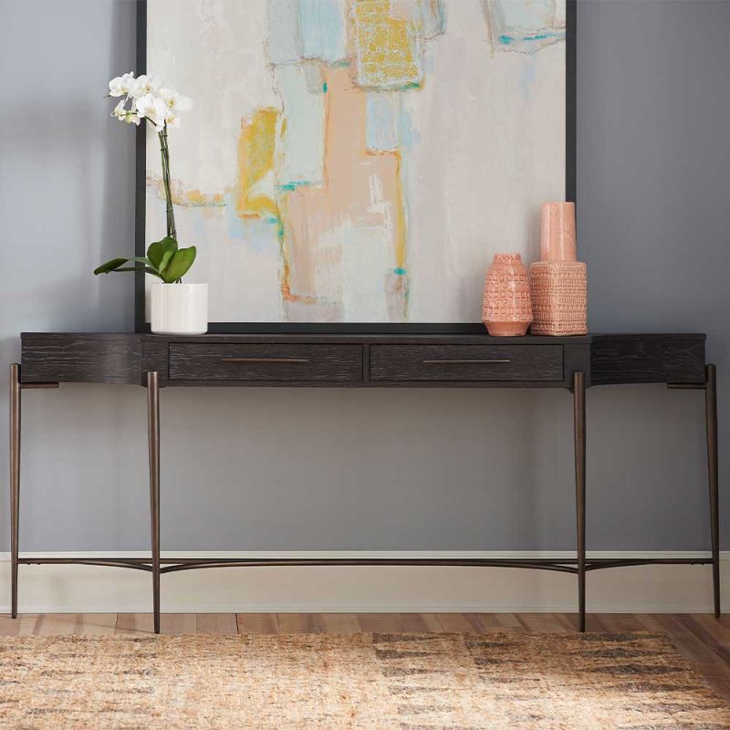 Console table with two drawers and thin bronzed legs