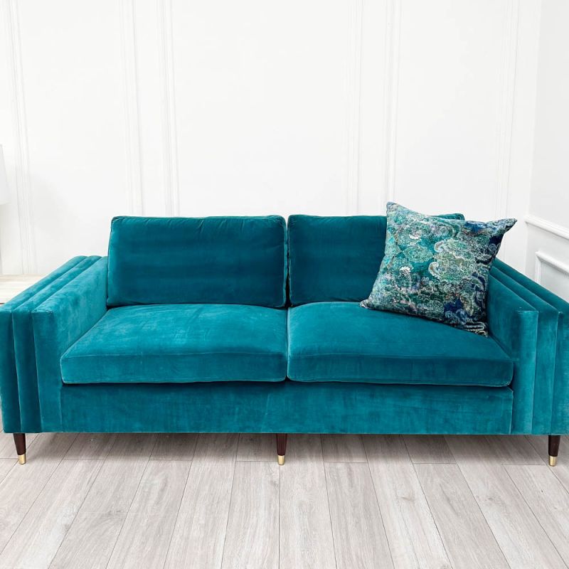 A luxurious teal-coloured 4-seater sofa