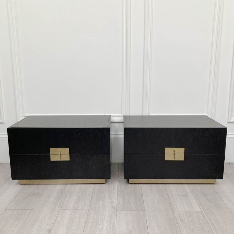 Pair of bedside tables with two drawers and brass details.