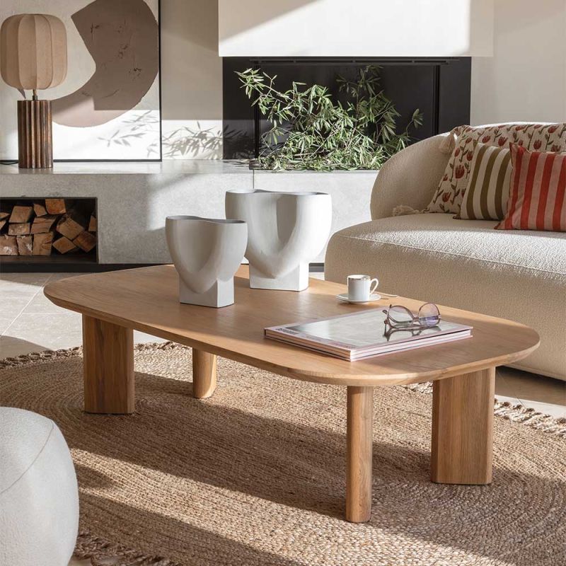 Scandi-inspired coffee table with light wood finish and turned-in legs