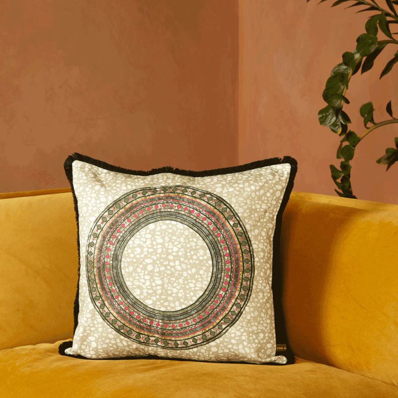 A luxury cushion by Eva Sonaike with a khaki African-inspired pattern and fringing