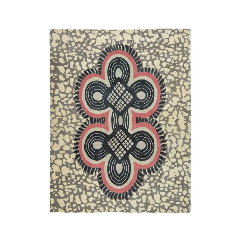 Striking patterned rug with red details and batik style