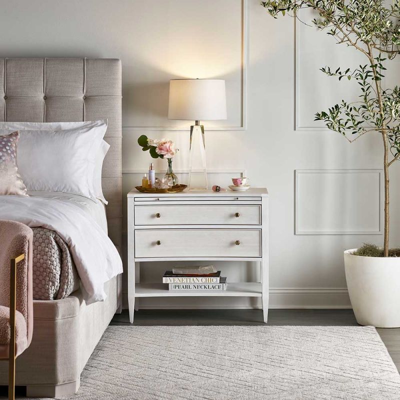 White bedside table with two drawers and pull out tray