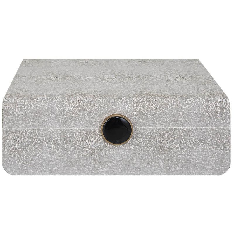 A stylish shagreen box with a white finish and black enamel closure