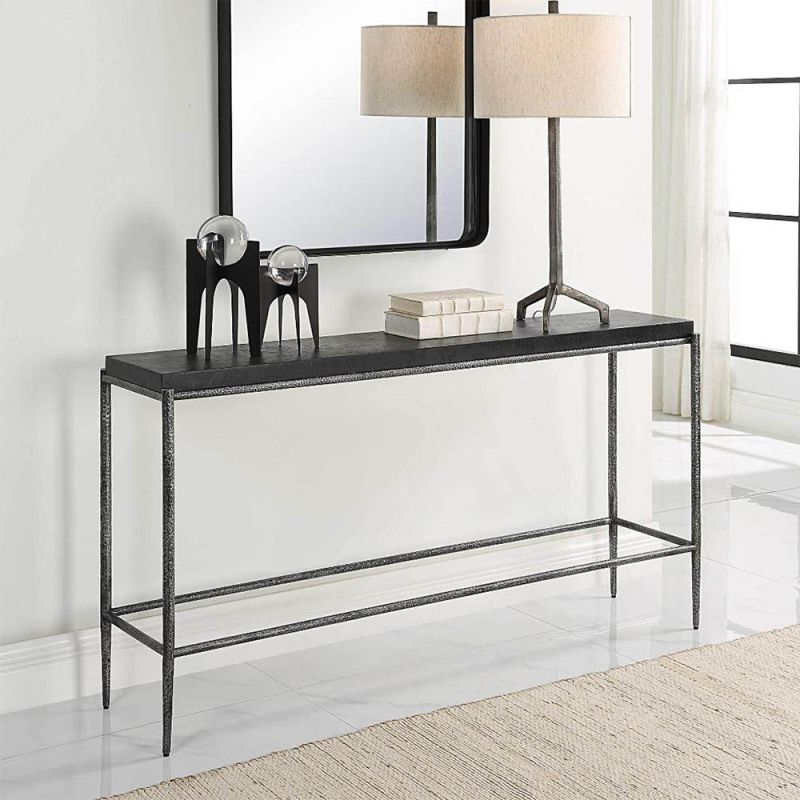 Minimalist console table with hammered texture and shiny black finish