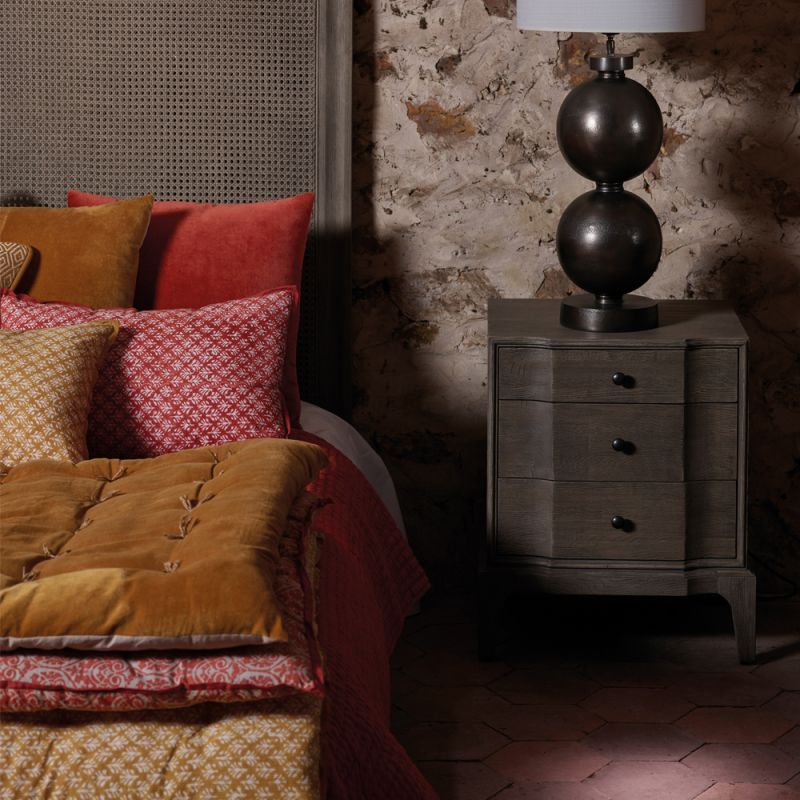 burnt orange leaf-print bedspread