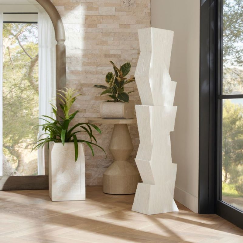 The Darnell Floor Sculpture’s geometric matte resin design is accented by a dynamic faux wood texture.