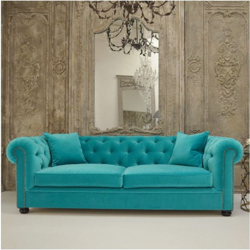 Luxury chic sofa with rolled studded arms and thick deep buttoned back