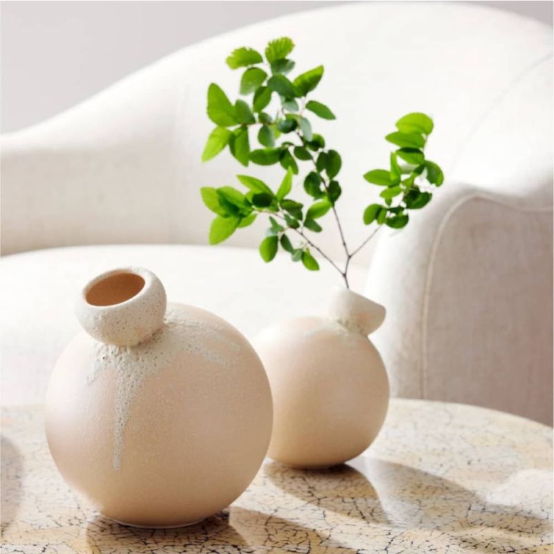 The Gracie Vases, with their bubble-like shape and peaches and cream glaze, bring playful elegance to any room.