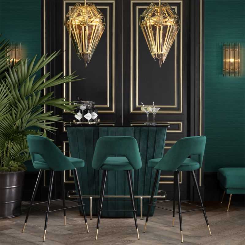 Luxurious modern dark green velvet counter stools by Eichholtz