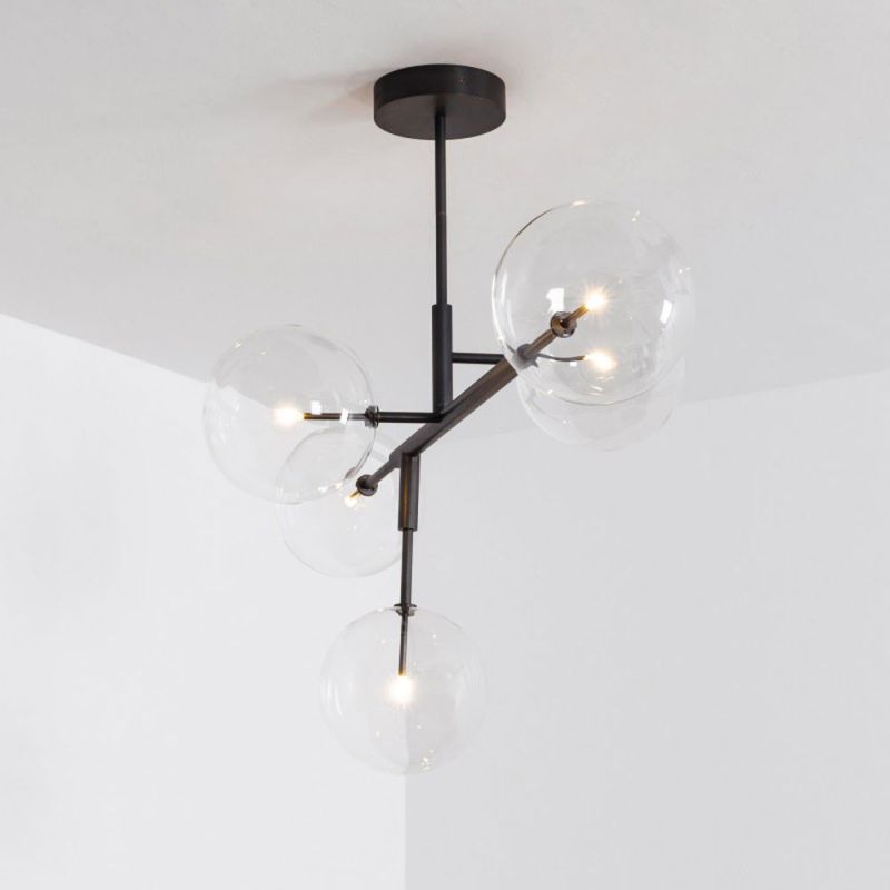 A chic and sophisticated black gunmetal LED pendant with transparent glass lampshades