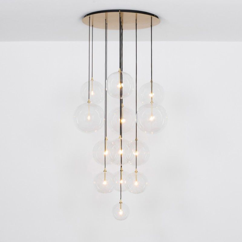 Glamorous industrial chandelier with multiple hanging clear glass globe lampshades