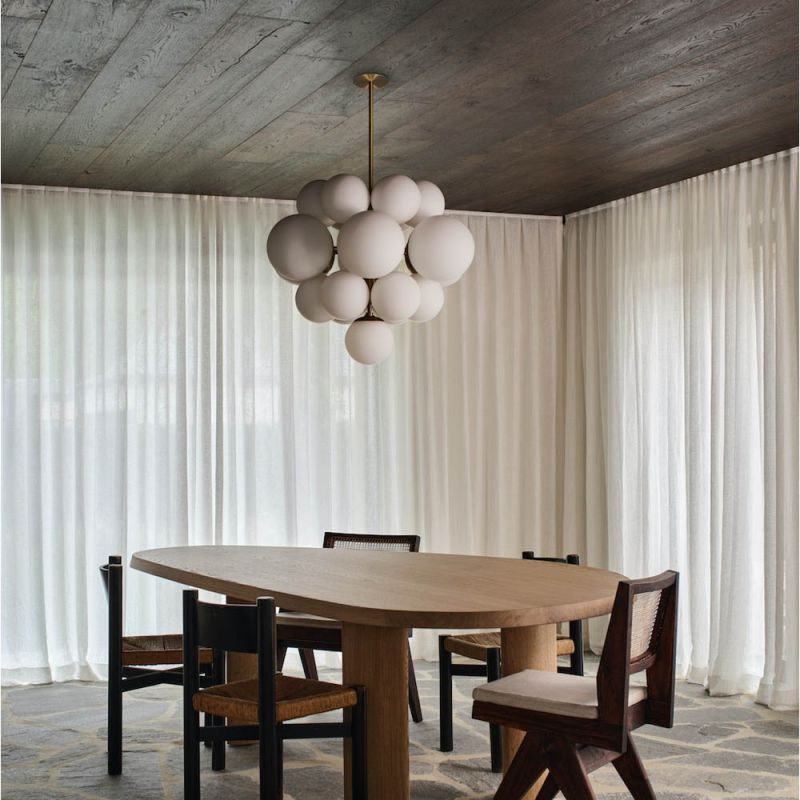 Elegant and eye-catching chandelier with glass orb shades with brass frame