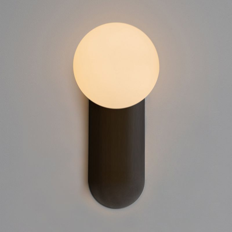 Enchanting rounded wall lamp mounted on gunmetal plate