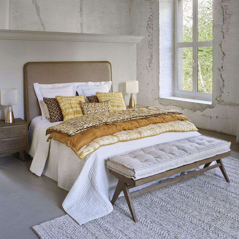 Vintage-style, wooden bench with a linen cushion