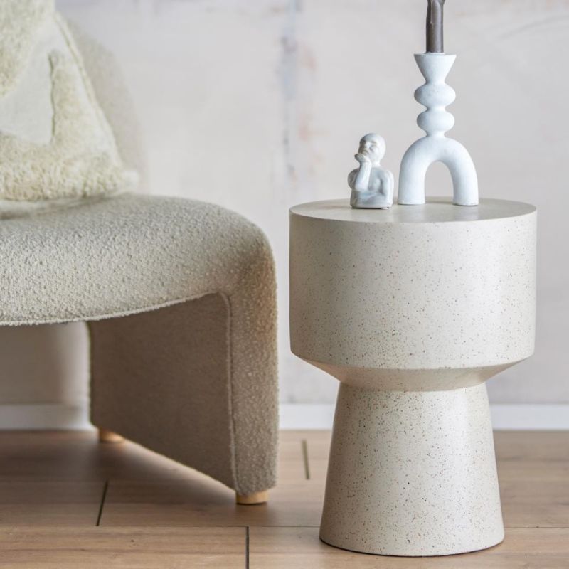 Sculptural resin side table with beige finish