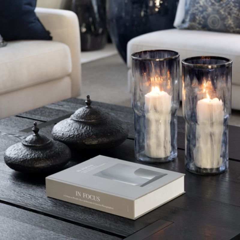 A hand-blown, enamelled glass lantern in marbled blue with a gold rim. A unique, elegant statement piece for any interior.