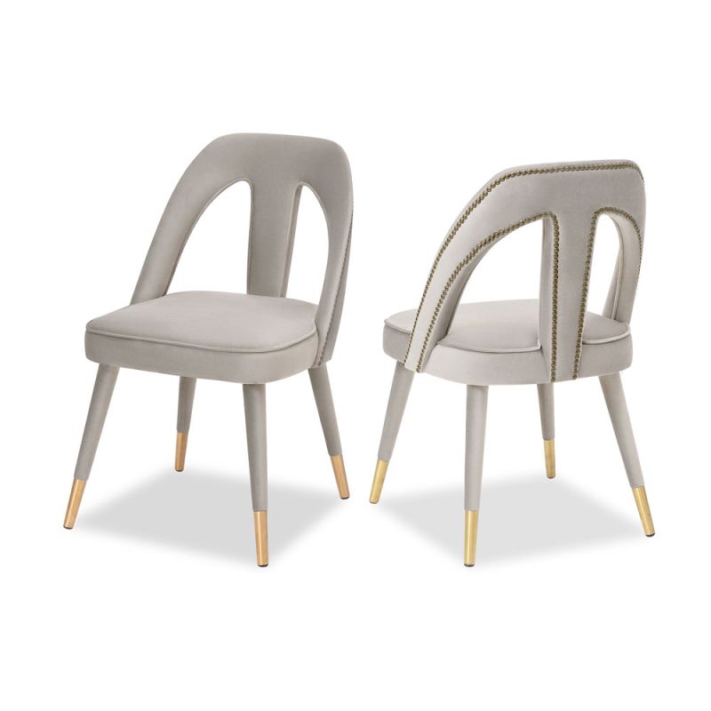 A luxury dining chair by Liang & Eimil with a gorgeous grey upholstery and brass detailing