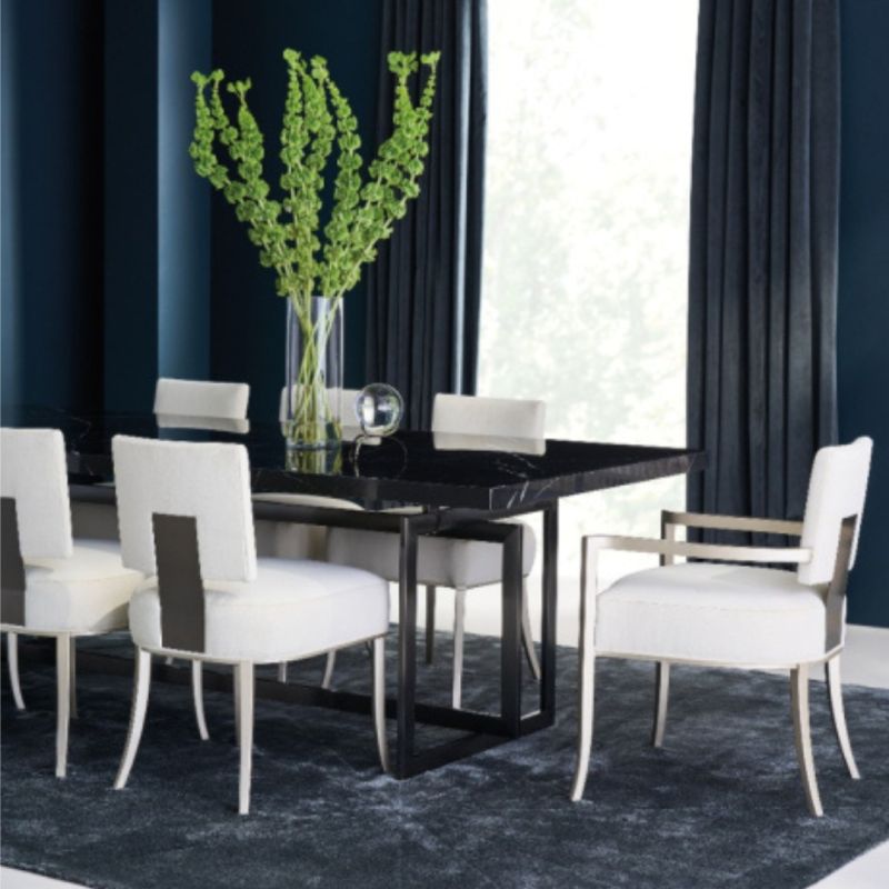 Elevate your dining experience with the Brentel Dining Table, featuring a stunning bronze base and elegant marble top. Perfect for any stylish space!